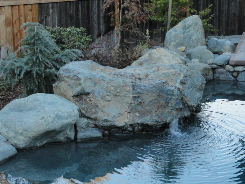 Boulders next to pool